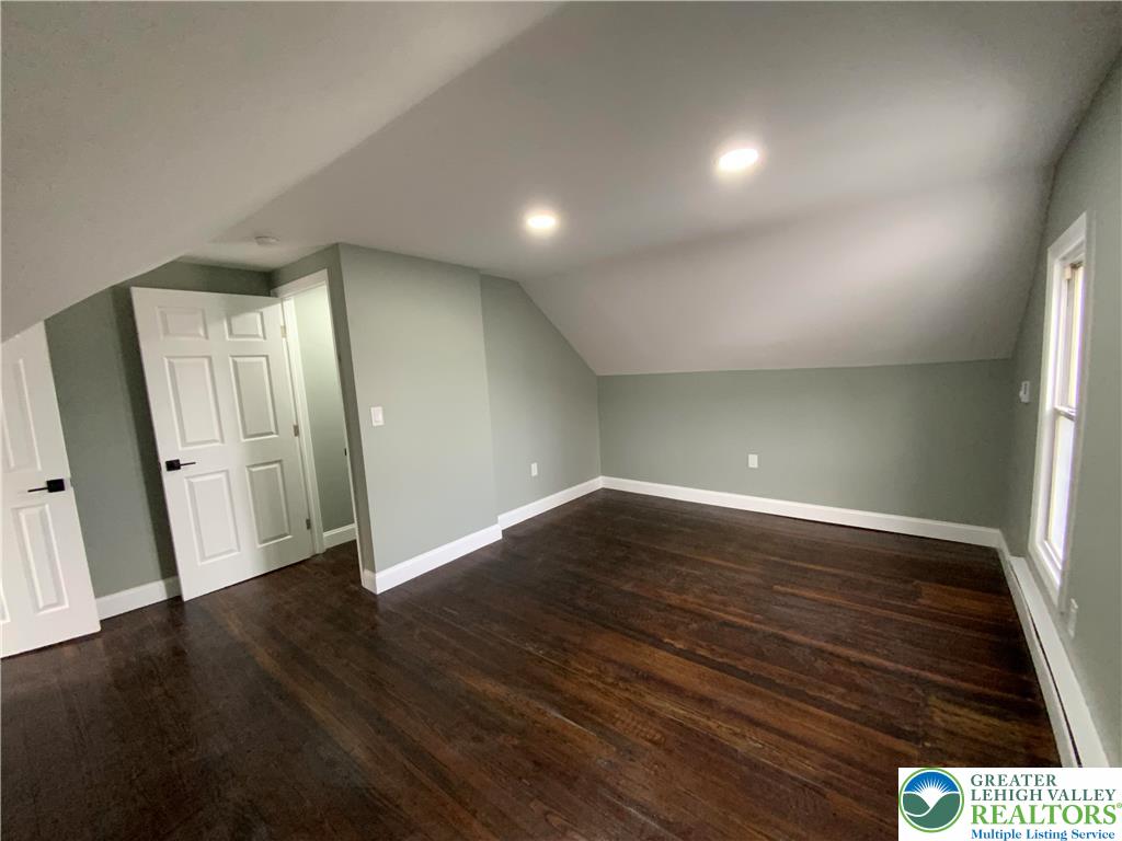 253 East Abbott Street Lansford, PA 18232 - Photo 22 of 43 an empty room with wooden floor and windows