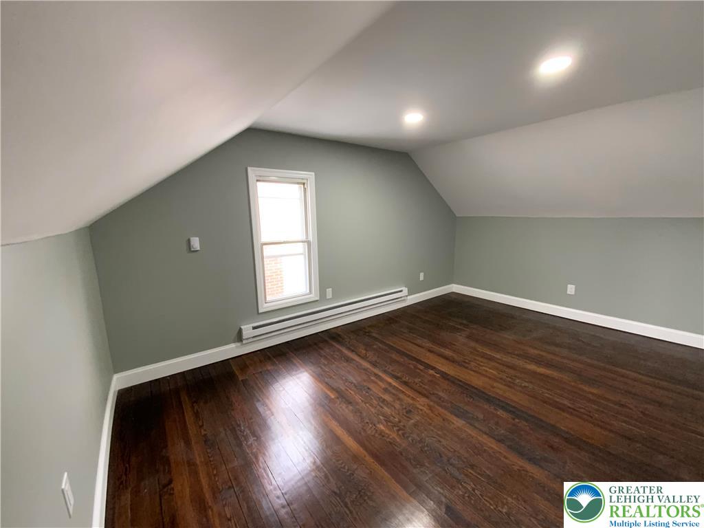 253 East Abbott Street Lansford, PA 18232 - Photo 23 of 43 an empty room with wooden floor and windows