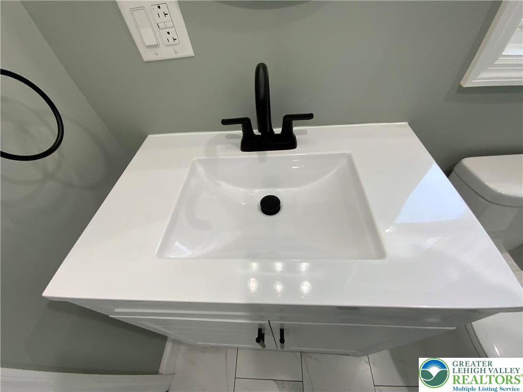 253 East Abbott Street Lansford, PA 18232 - Photo 27 of 43 a bathroom with a sink and a mirror