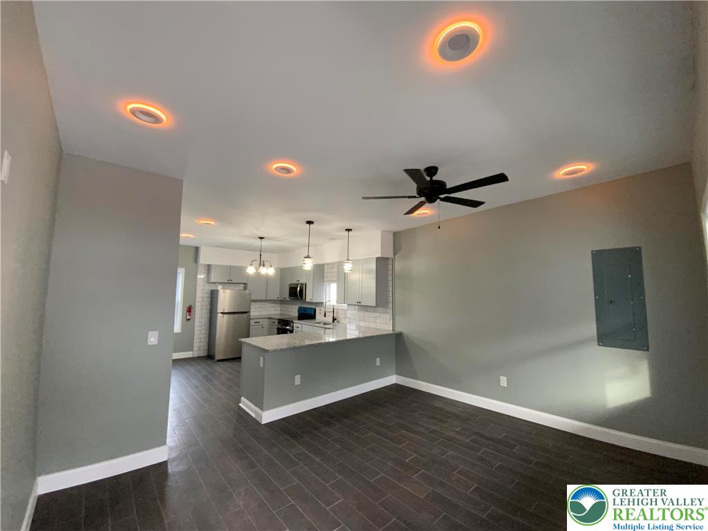 253 East Abbott Street Lansford, PA 18232 - Photo 36 of 43 a view of a kitchen with a sink hardwood floor and a ceiling fan