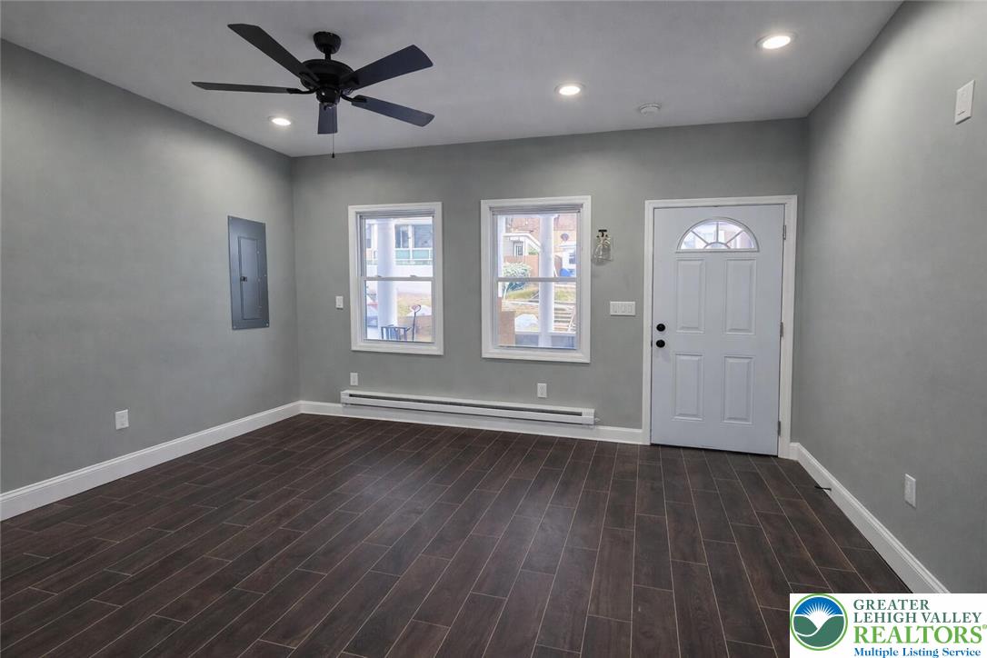 253 East Abbott Street Lansford, PA 18232 - Photo 5 of 43 an empty room with wooden floor and windows