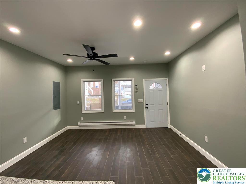 253 East Abbott Street Lansford, PA 18232 - Photo 6 of 43 an empty room with wooden floor and windows