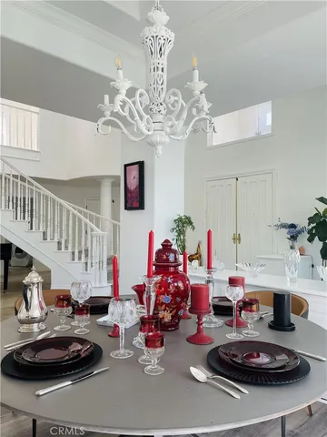 a play room with furniture and a chandelier