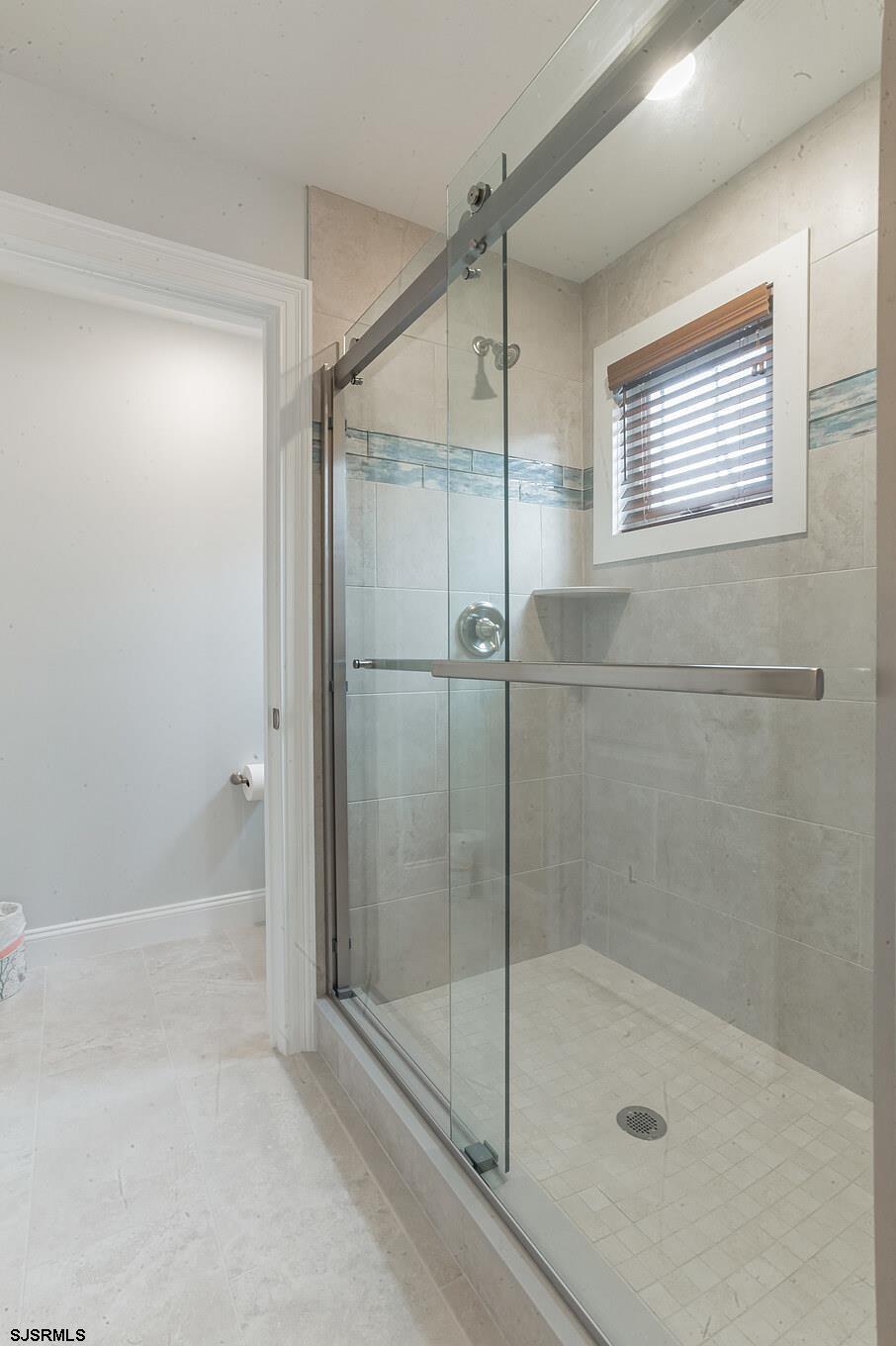 910 Ocean Avenue, Unit C Ocean City, NJ 08226 - Photo 15 of 30 a bathroom with a shower