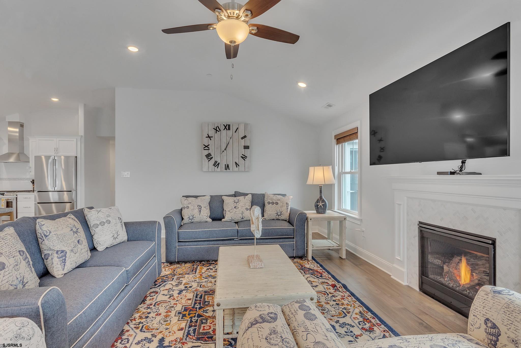 910 Ocean Avenue, Unit C Ocean City, NJ 08226 - Photo 5 of 30 a living room with furniture and a flat screen tv