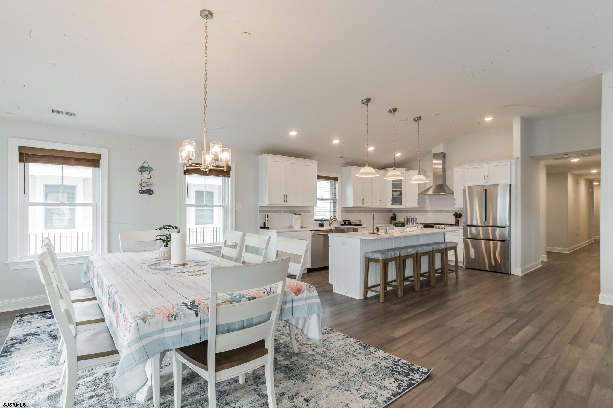 910 Ocean Avenue, Unit C Ocean City, NJ 08226 - Photo 8 of 30 a large kitchen with a table and chairs