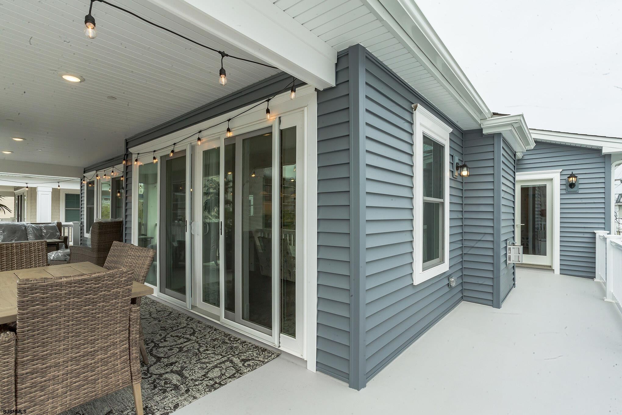 910 Ocean Avenue, Unit C Ocean City, NJ 08226 - Photo 10 of 30 a porch with seating space