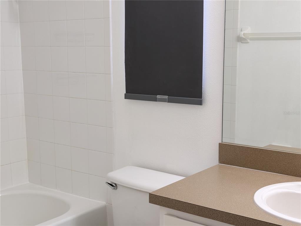 25403 Saddlehorn Way Land O Lakes, FL 34639 - Photo 13 of 18 a bathroom with a bathtub and a toilet