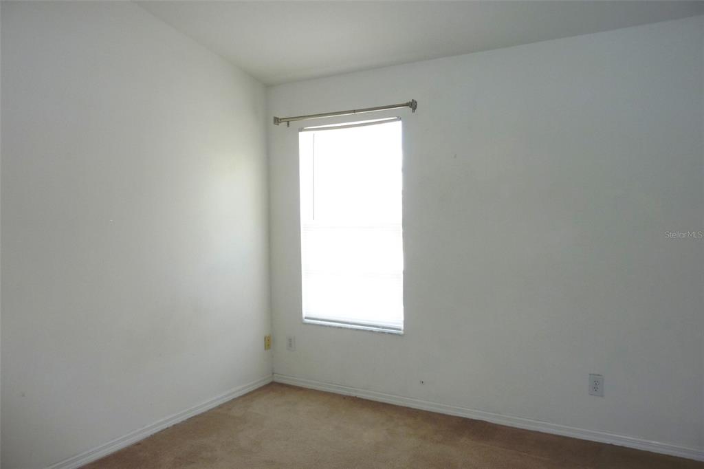 25403 Saddlehorn Way Land O Lakes, FL 34639 - Photo 15 of 18 an empty room with a window