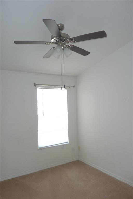 25403 Saddlehorn Way Land O Lakes, FL 34639 - Photo 17 of 18 an empty room with a window