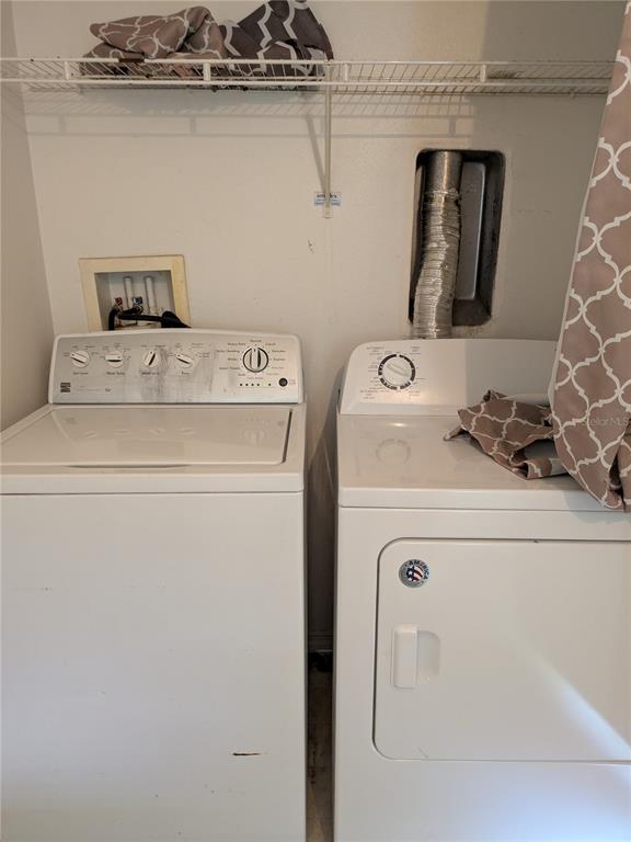 25403 Saddlehorn Way Land O Lakes, FL 34639 - Photo 18 of 18 a utility room with dryer and washer
