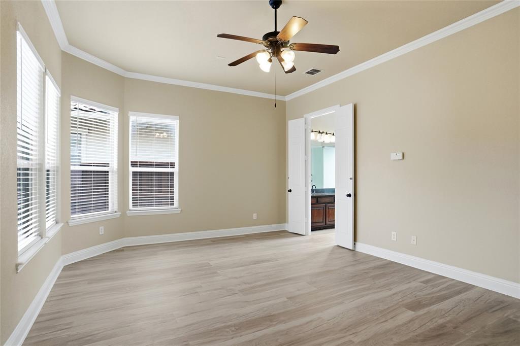 838 San Clemente Irving, TX 75039 - Photo 12 of 24 a view of an empty room with a window and wooden floor