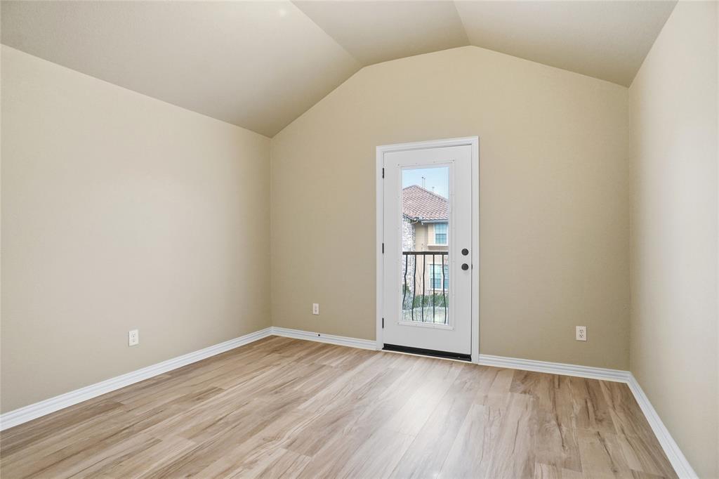 838 San Clemente Irving, TX 75039 - Photo 18 of 24 an empty room with wooden floor and windows