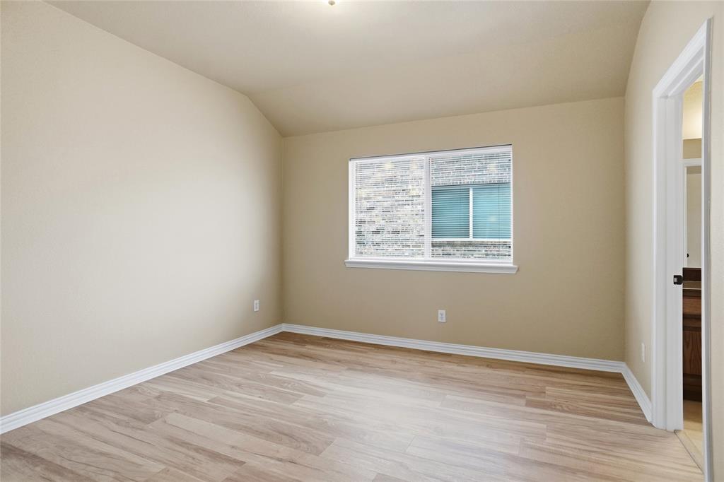 838 San Clemente Irving, TX 75039 - Photo 19 of 24 wooden floor in an empty room with a window
