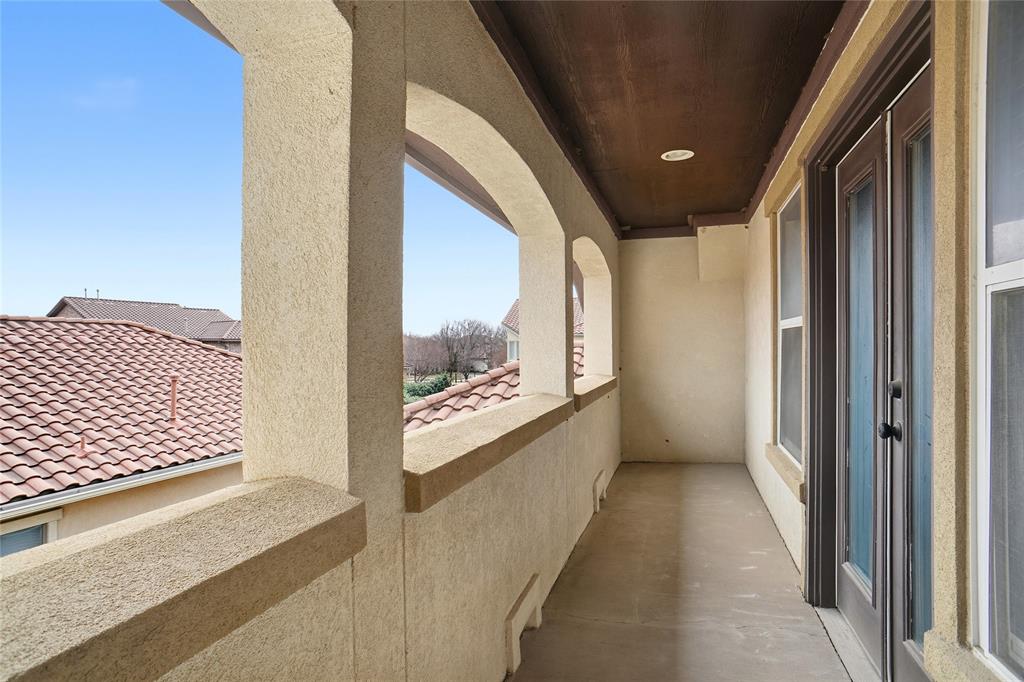 838 San Clemente Irving, TX 75039 - Photo 22 of 24 a view of a hallway with wooden floor and a bathroom