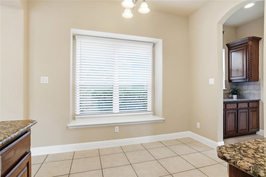 838 San Clemente Irving, TX 75039 - Photo 8 of 24 a view of an empty room with window and cabinet