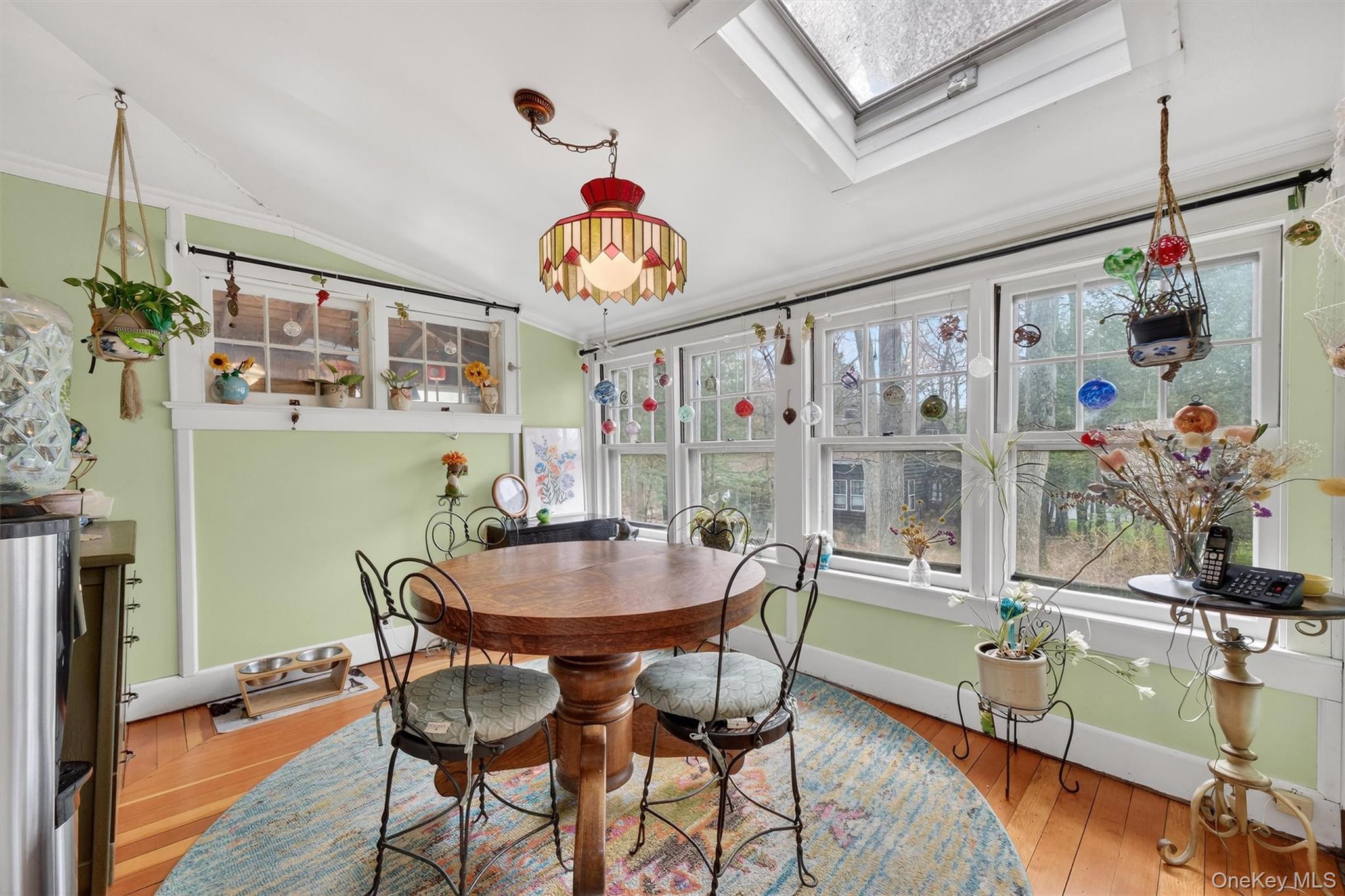 13 Perry Trail Carmel, NY 10512 - Photo 11 of 49 Light-filled dining area surrounded by windows with peaceful wooded views - one of the cutest spots in the home