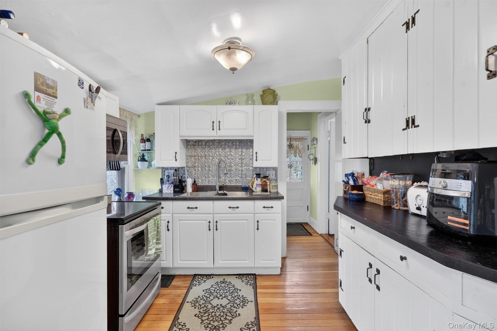 13 Perry Trail Carmel, NY 10512 - Photo 13 of 49 Eye-catching tin backsplash brings character to the space
