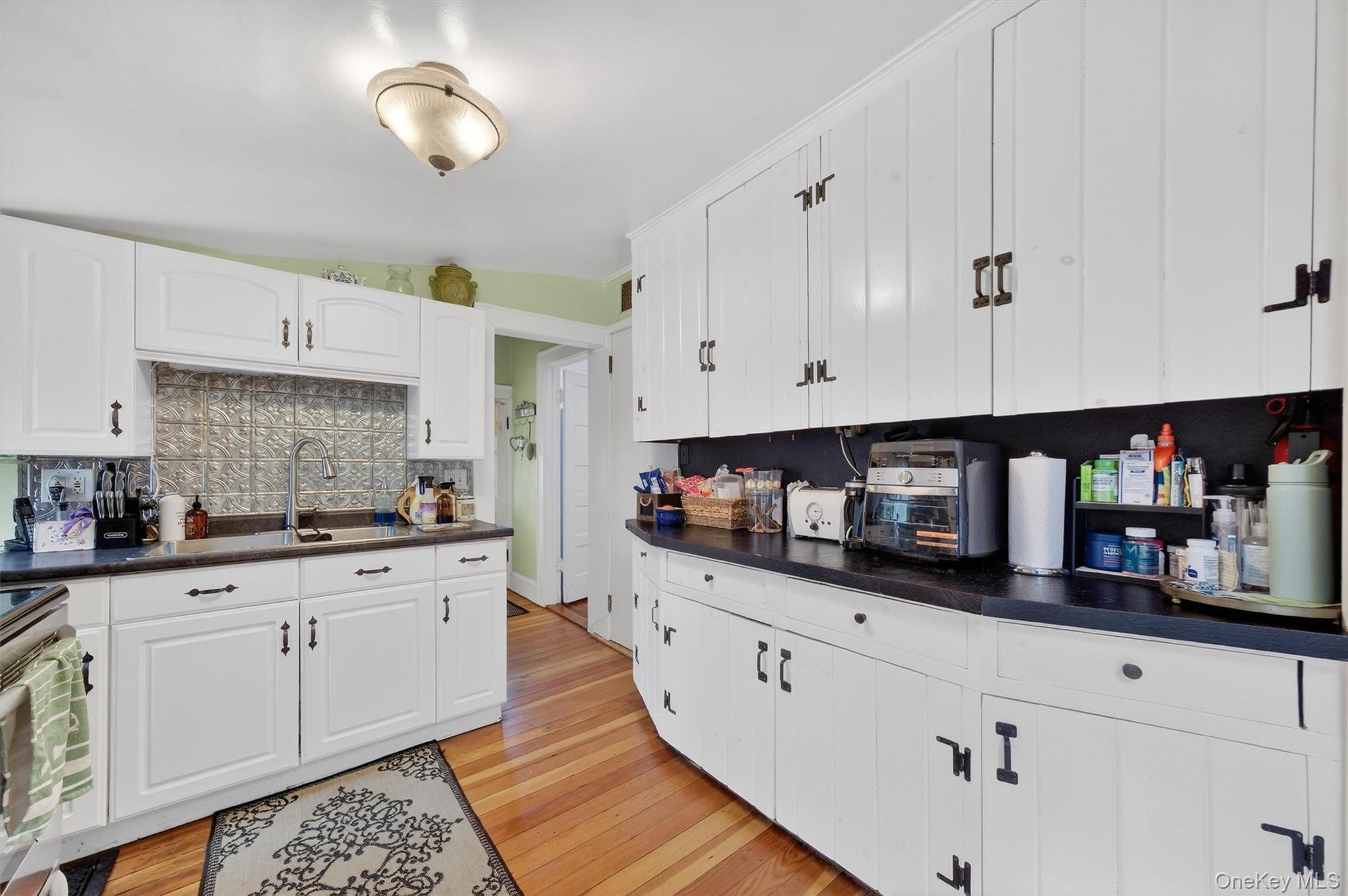 13 Perry Trail Carmel, NY 10512 - Photo 15 of 49 Designed for everyday ease - double sink, gooseneck faucet, tin backsplash, and lots of prep space