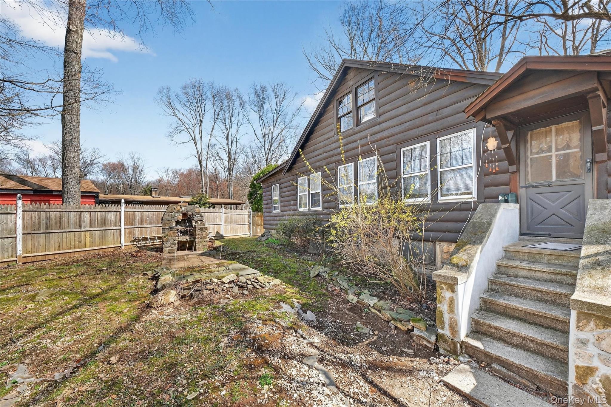 13 Perry Trail Carmel, NY 10512 - Photo 31 of 49 Backyard view featuring a stone fireplace - perfect for grilling and outdoor gatherings