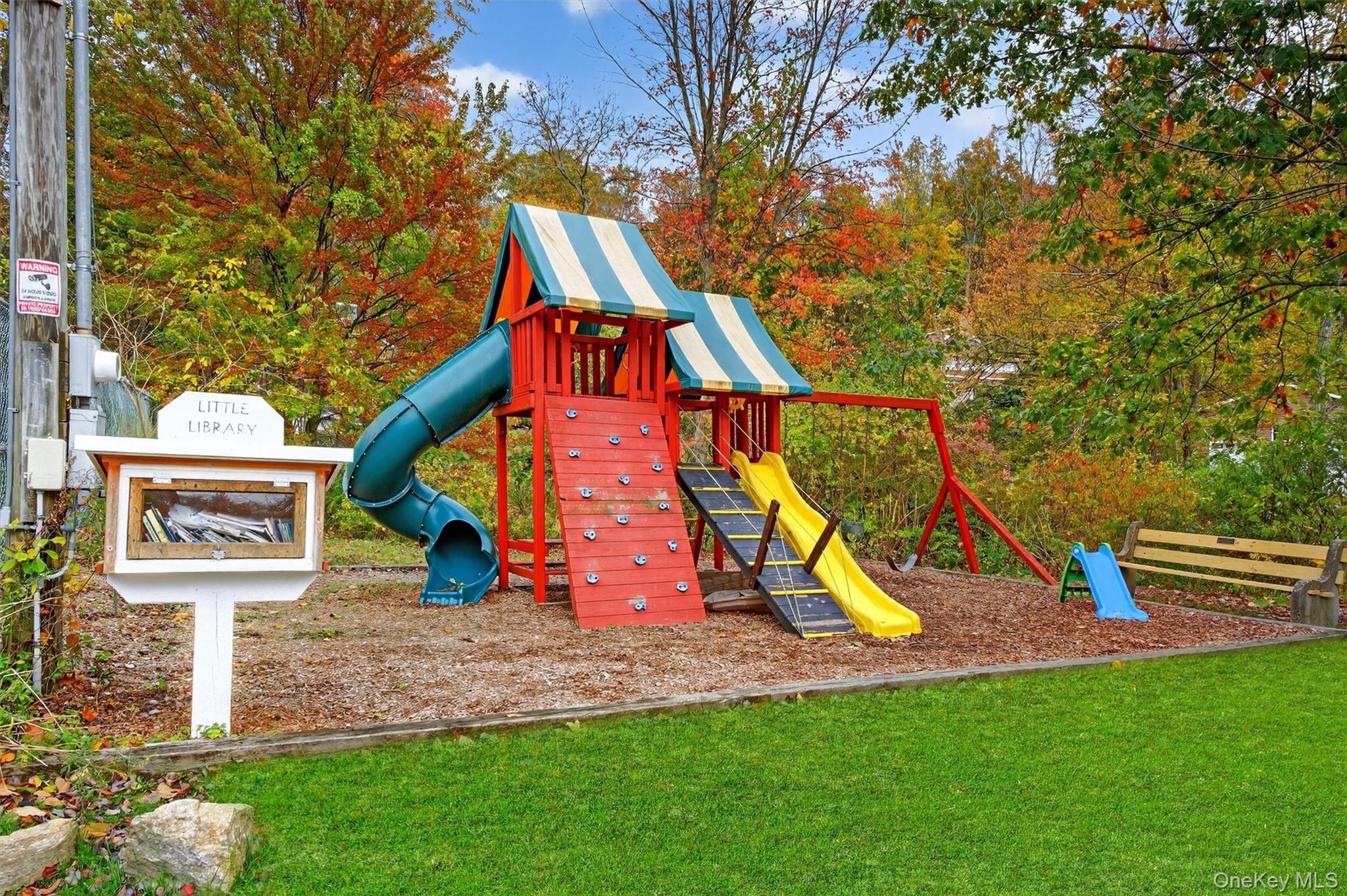 13 Perry Trail Carmel, NY 10512 - Photo 45 of 49 A fun spot for the youngest residents - playground play and a little library to explore.