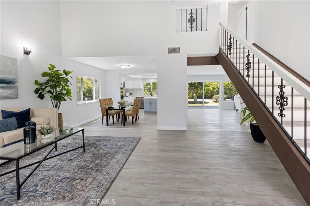 a view of an entryway and livingroom with furniture
