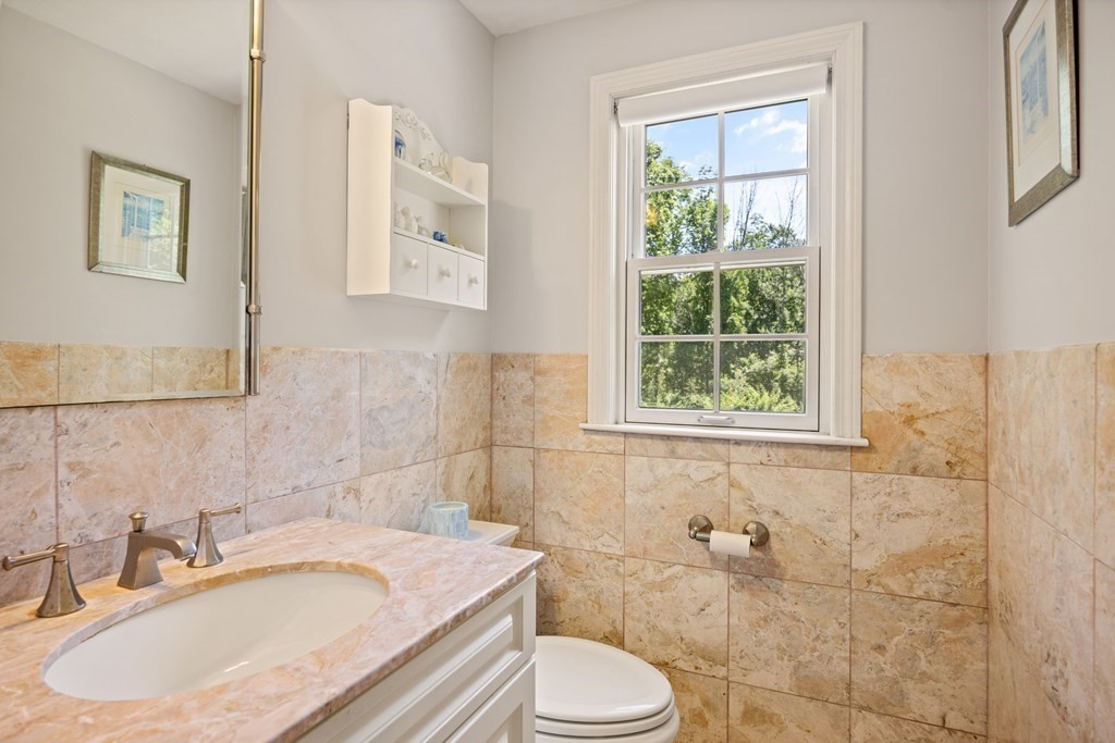258 Pelham Island Road Wayland, MA 01778 - Photo 23 of 40 a bathroom with a sink toilet and mirror