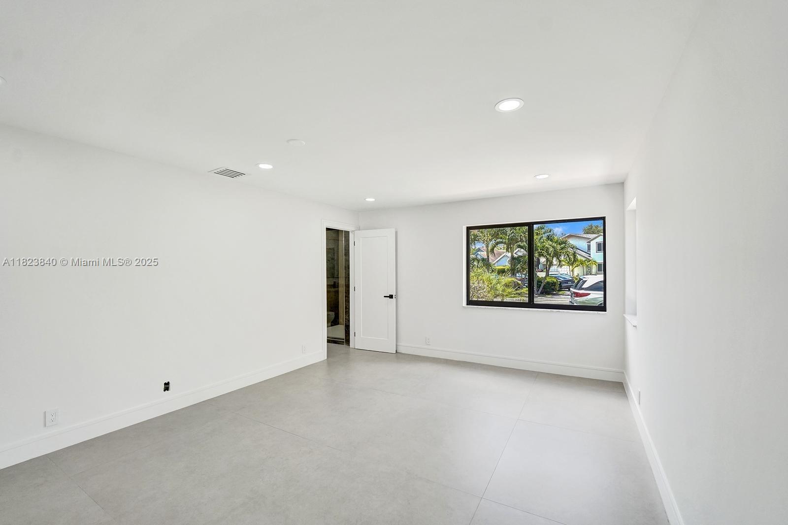 7340 Andorra Place Boca Raton, FL 33433 - Photo 30 of 99 a view of an empty room with a window