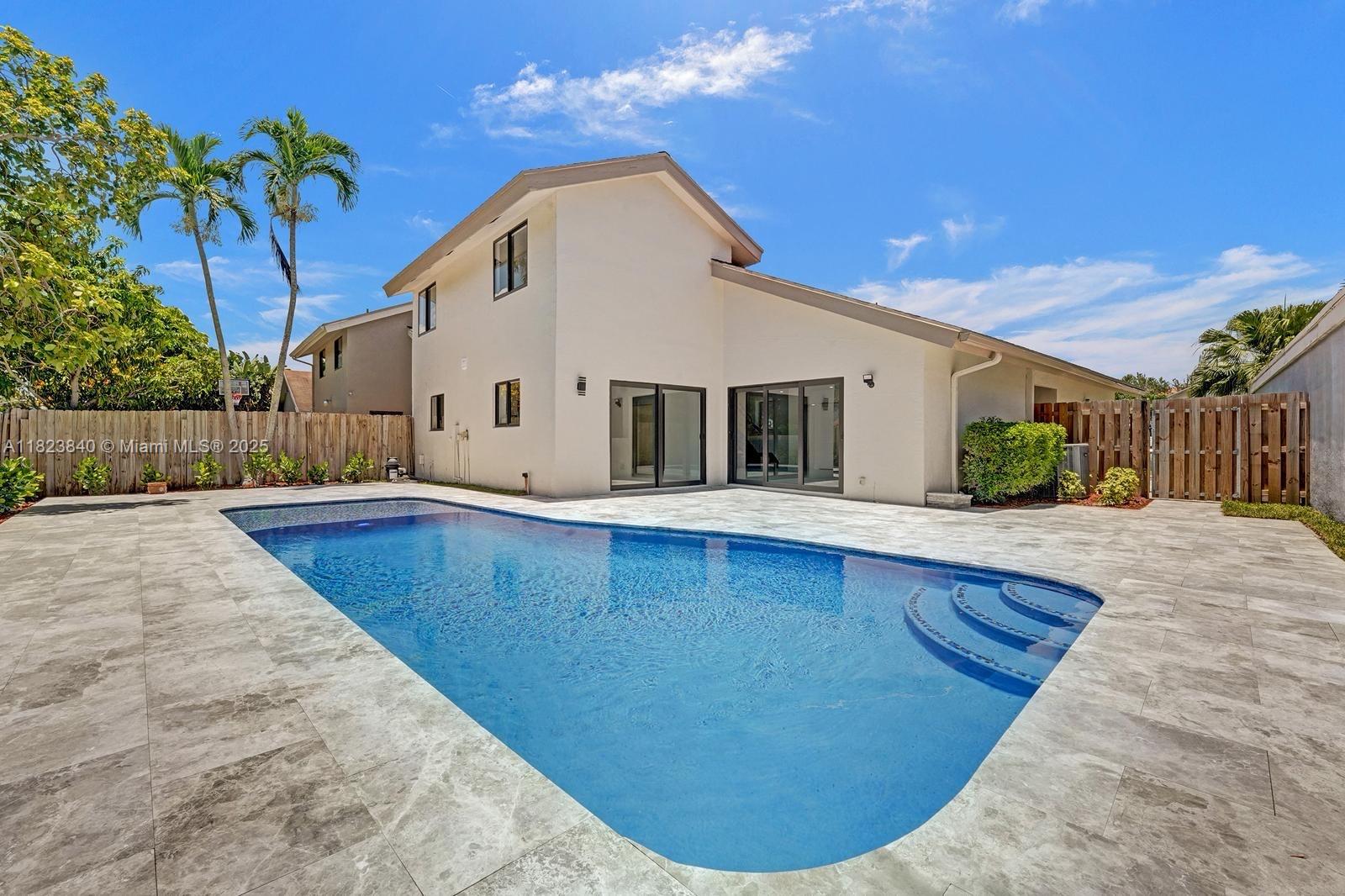7340 Andorra Place Boca Raton, FL 33433 - Photo 35 of 99 a view of a house with a swimming pool