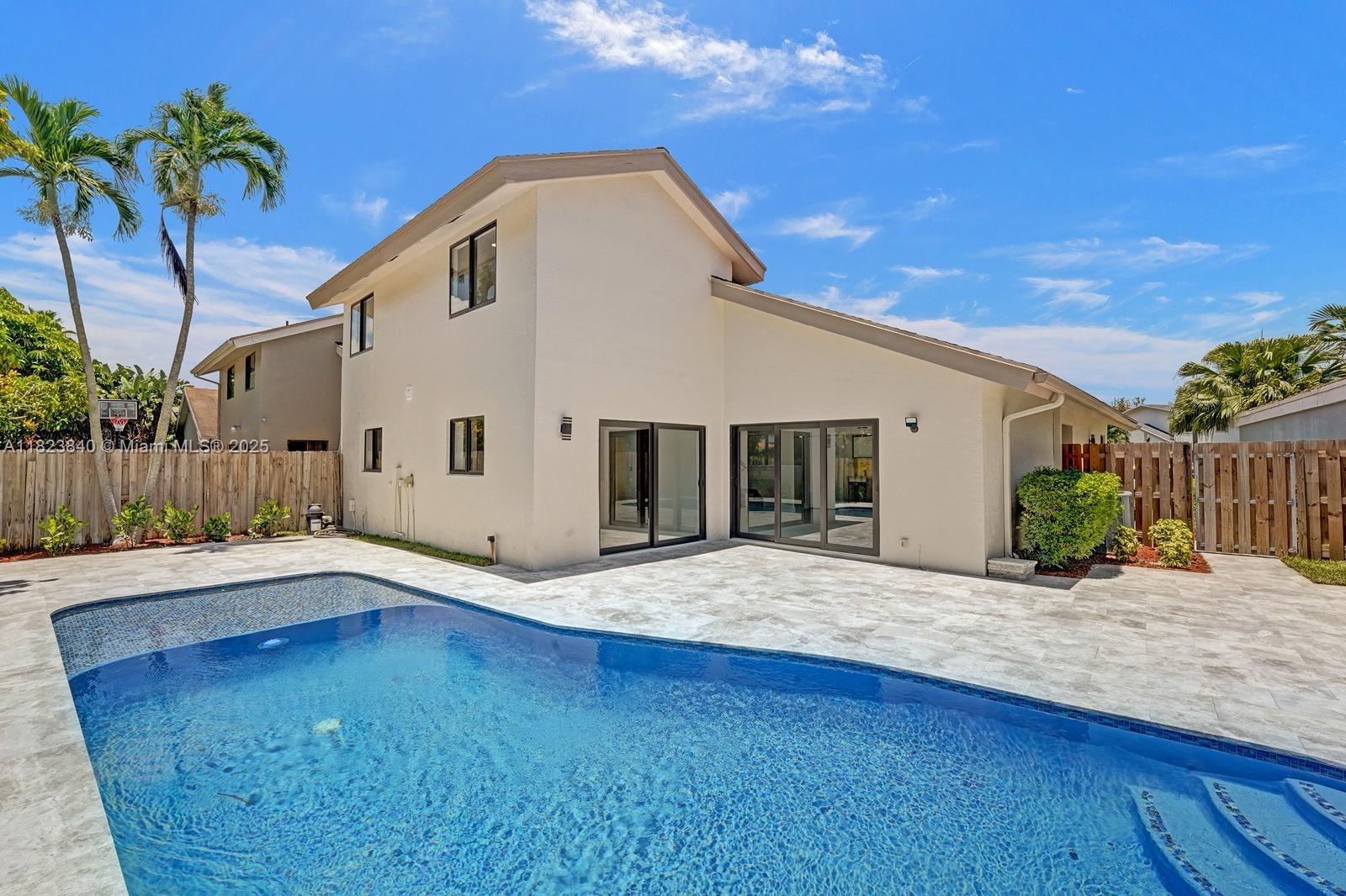 7340 Andorra Place Boca Raton, FL 33433 - Photo 37 of 99 a front view of a house with a yard