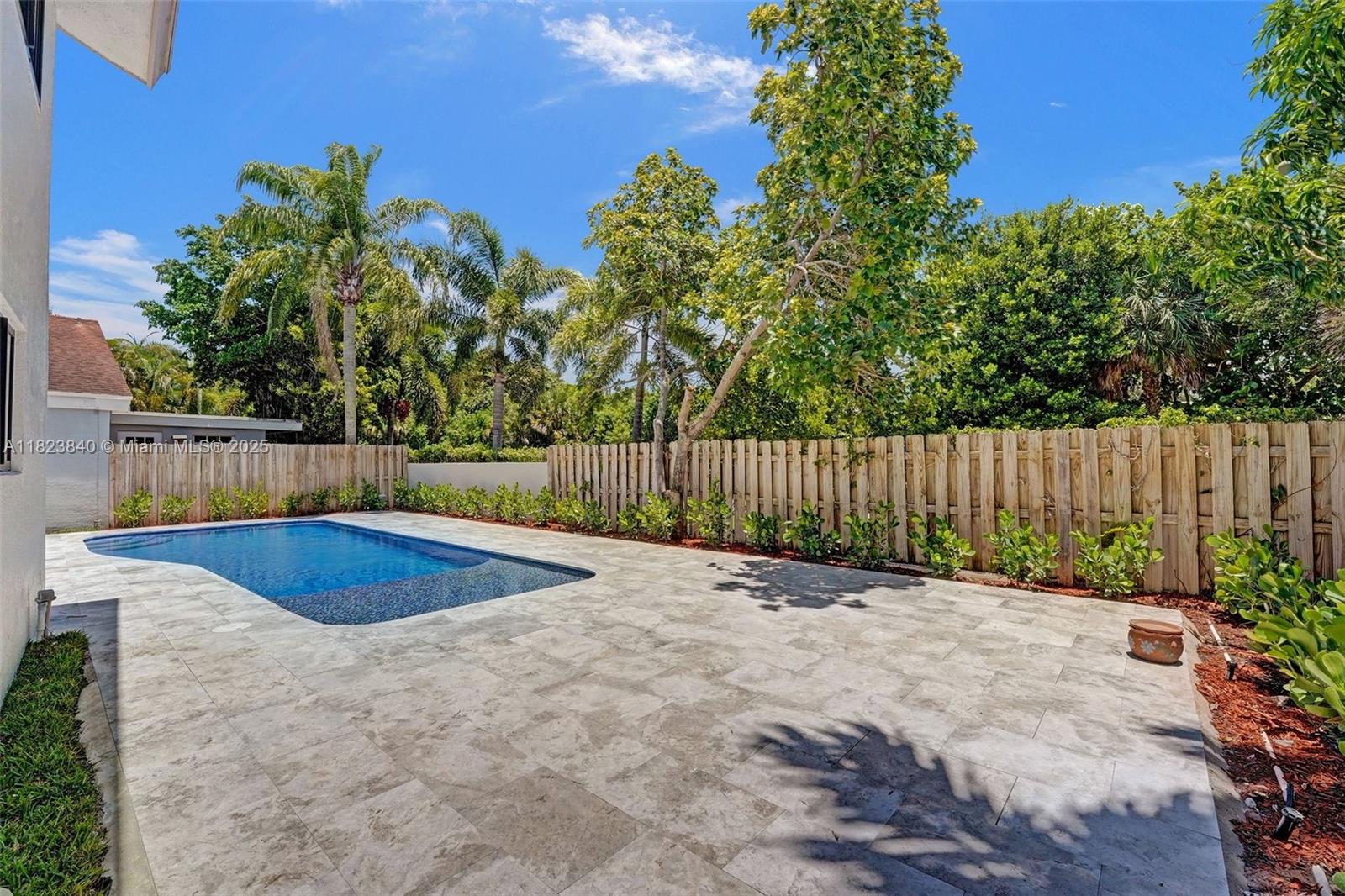 7340 Andorra Place Boca Raton, FL 33433 - Photo 42 of 99 a backyard of a house with lots of green space