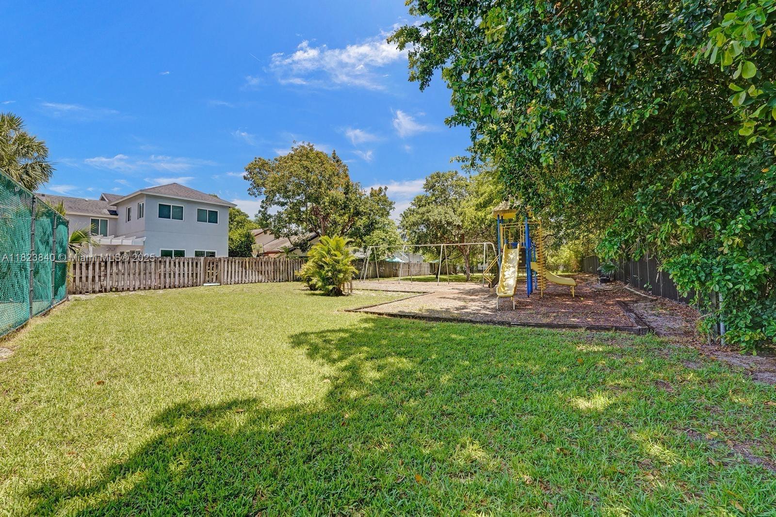 7340 Andorra Place Boca Raton, FL 33433 - Photo 44 of 99 a view of a house with a yard