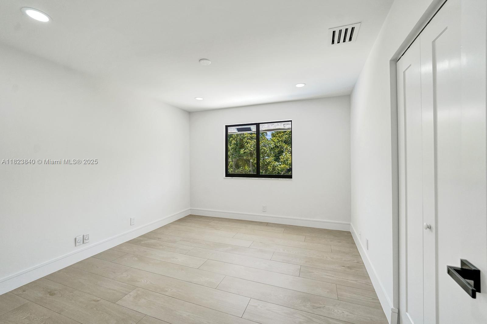 7340 Andorra Place Boca Raton, FL 33433 - Photo 58 of 99 an empty room with a window