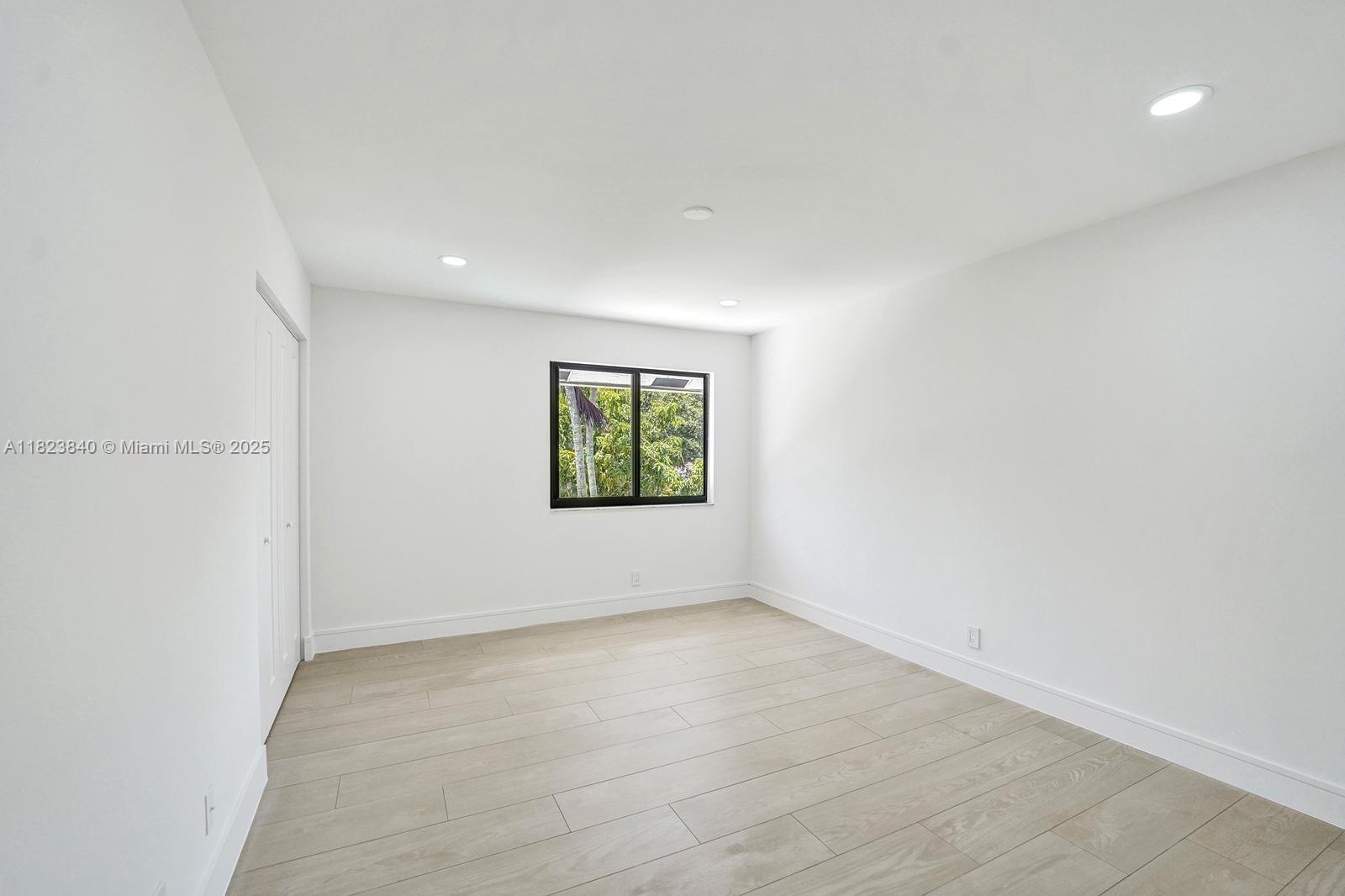 7340 Andorra Place Boca Raton, FL 33433 - Photo 62 of 99 an empty room with windows