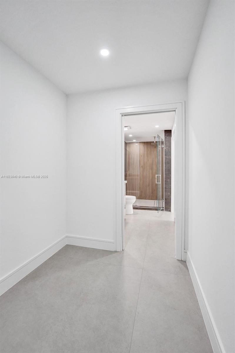 7340 Andorra Place Boca Raton, FL 33433 - Photo 77 of 99 an empty room with a window