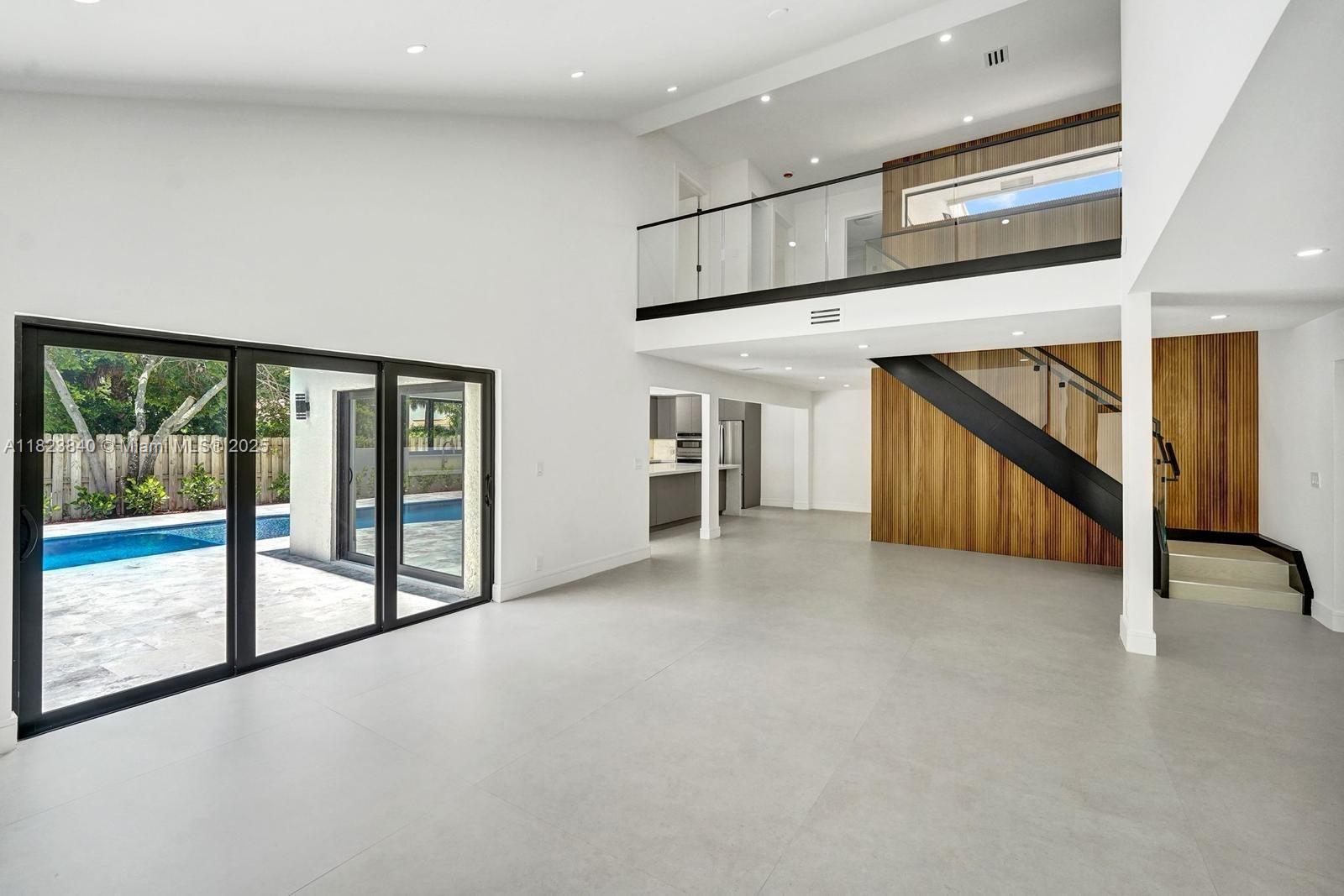 7340 Andorra Place Boca Raton, FL 33433 - Photo 80 of 99 a view of an empty room with stairs