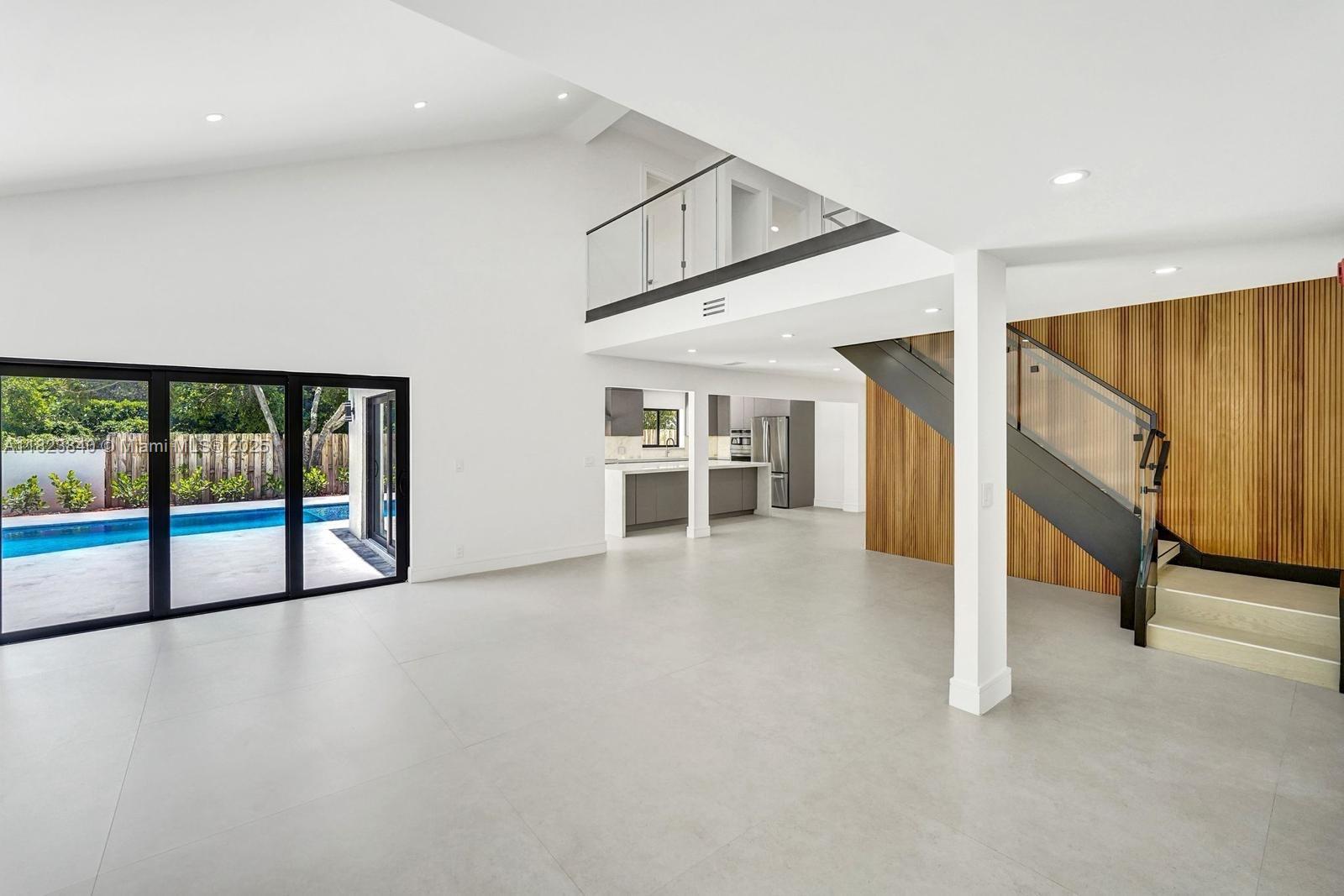 7340 Andorra Place Boca Raton, FL 33433 - Photo 81 of 99 a view of an empty room with window and stairs