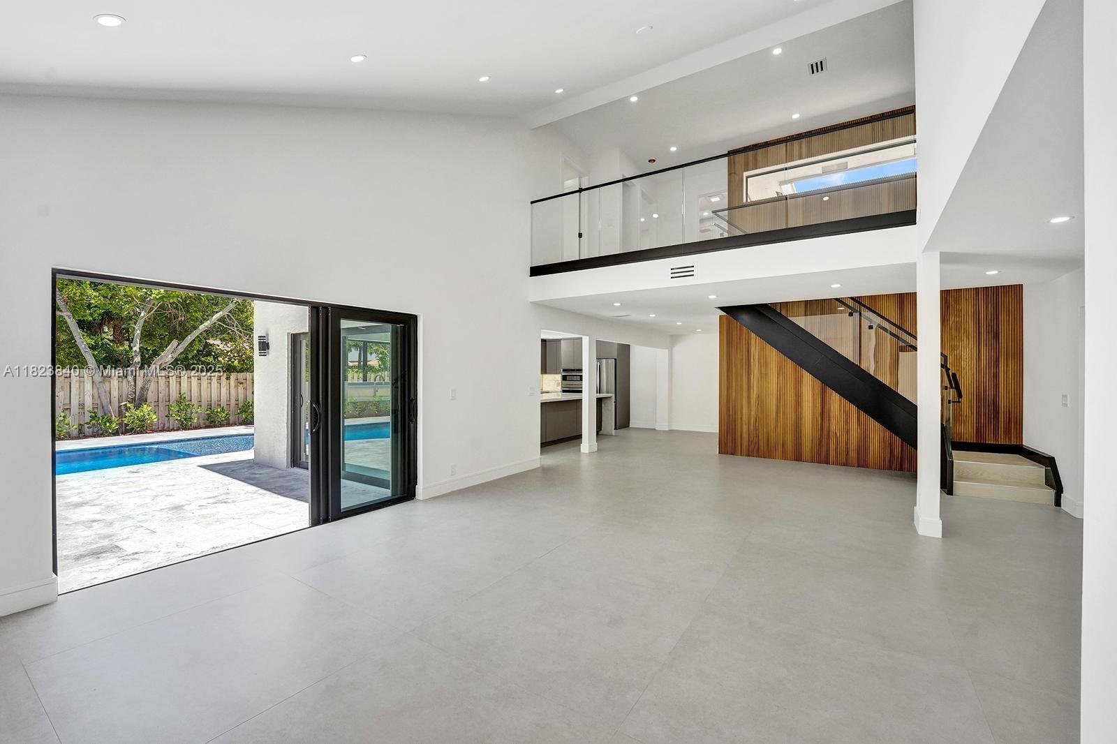 7340 Andorra Place Boca Raton, FL 33433 - Photo 83 of 99 a view of an empty room with stairs