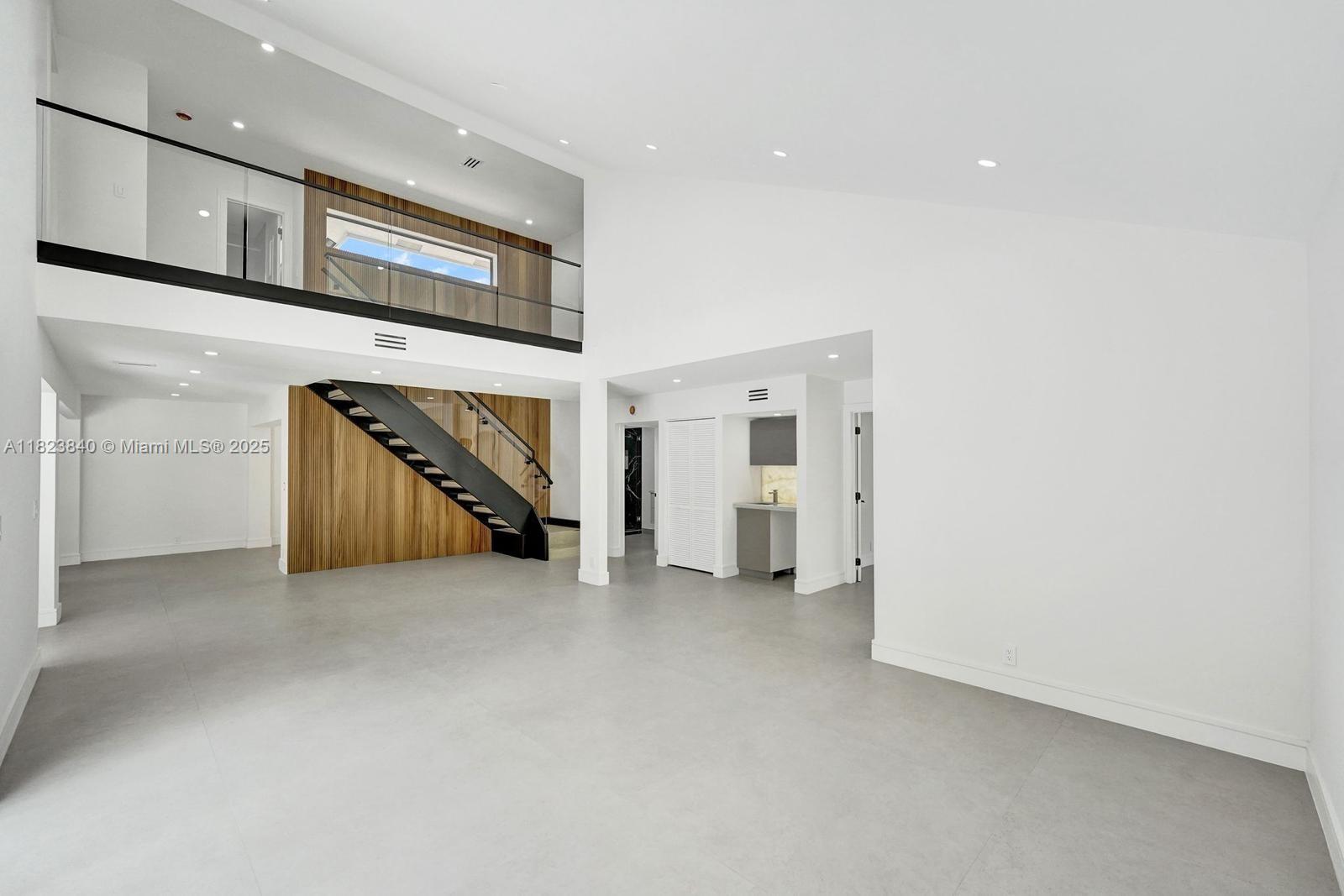 7340 Andorra Place Boca Raton, FL 33433 - Photo 84 of 99 a view of an empty room with stairs