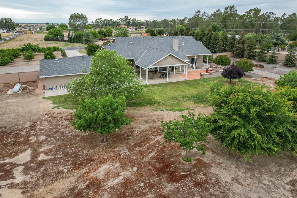 17465 Monreal Road Madera, CA 93636 - Photo 44 of 59 an aerial view of a house with yard and green space