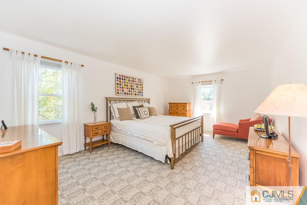 24 Taylor Road Princeton, NJ 08540 - Photo 12 of 25 a bedroom with a bed and a couch