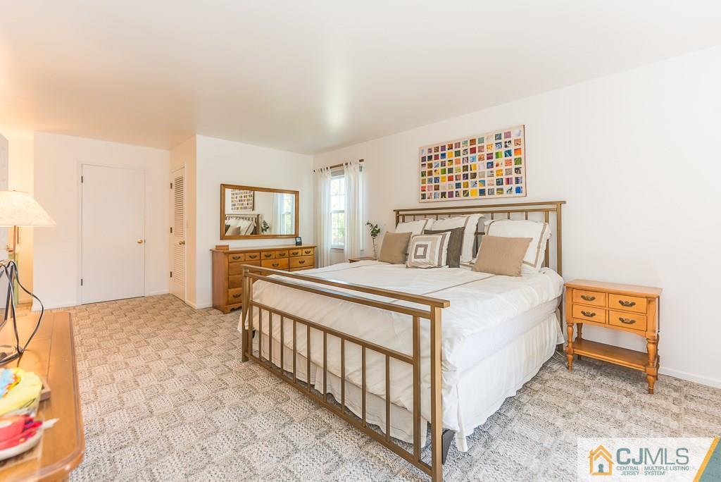24 Taylor Road Princeton, NJ 08540 - Photo 13 of 25 a bedroom with a bed and a couch
