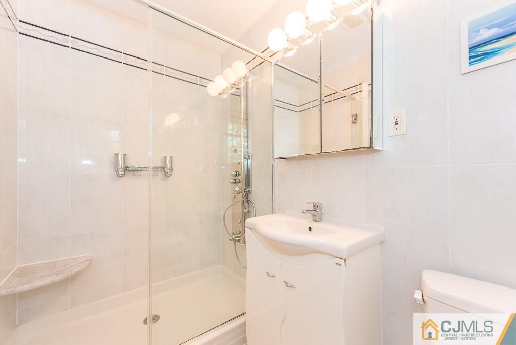 24 Taylor Road Princeton, NJ 08540 - Photo 16 of 25 a bathroom with a sink a toilet and shower