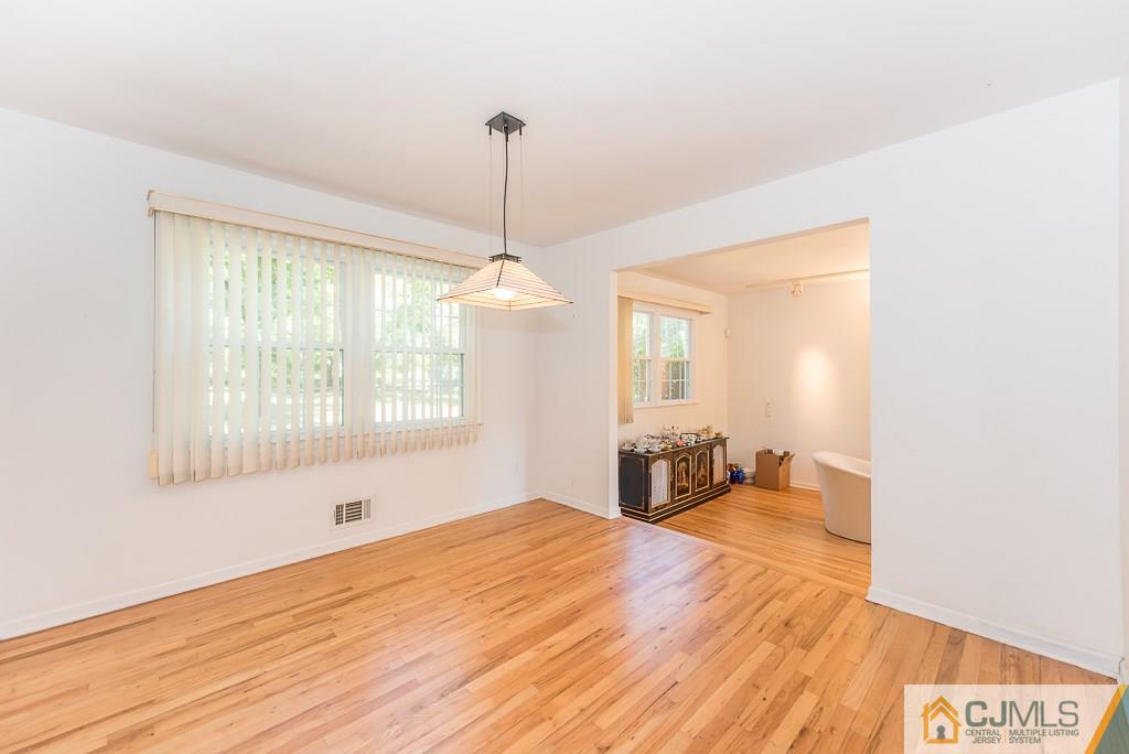 24 Taylor Road Princeton, NJ 08540 - Photo 9 of 25 a bedroom with a bed and wooden floor