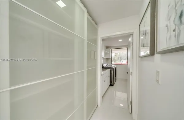 a bathroom with a shower and a sink