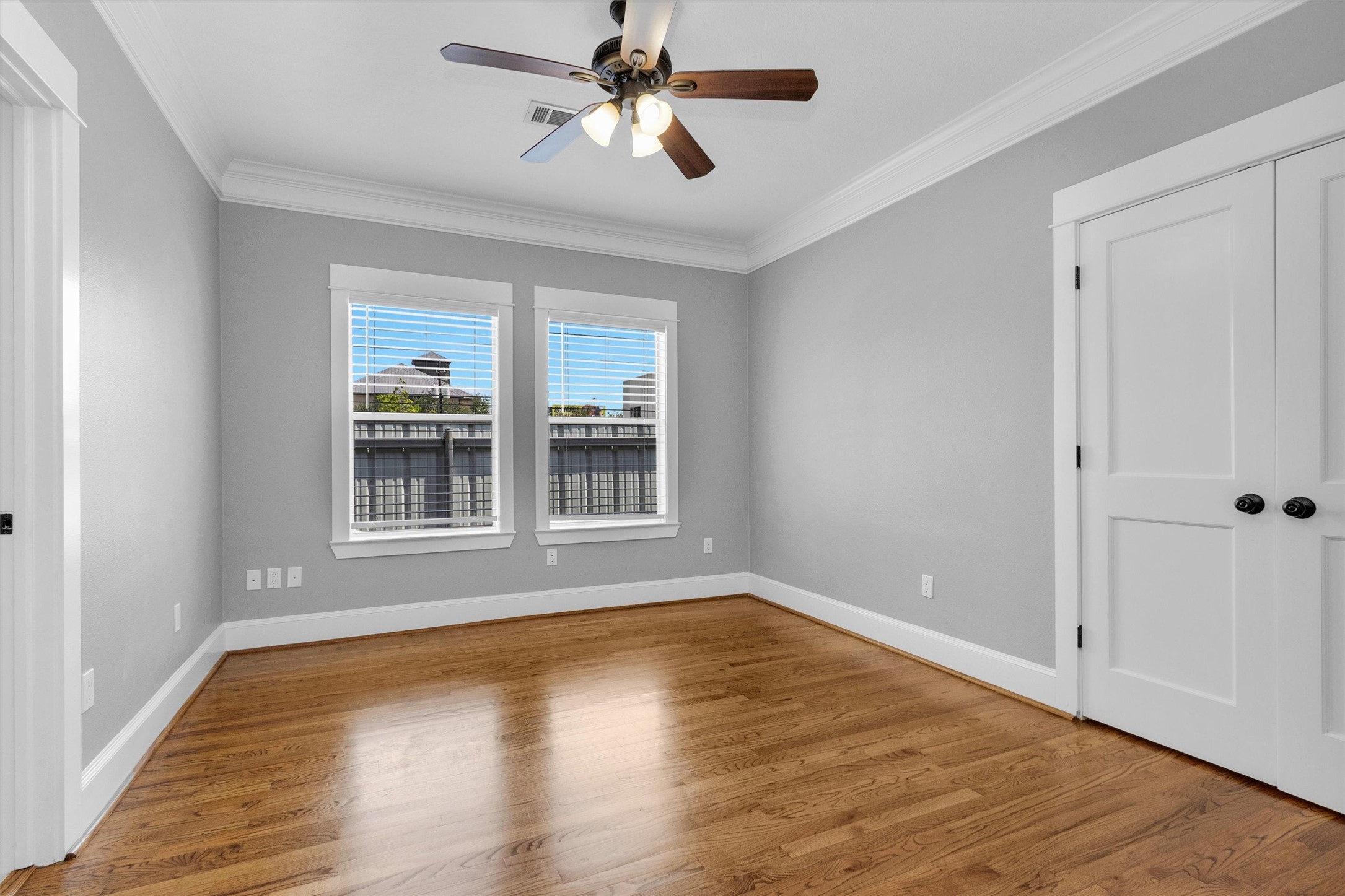 304 Vincent Street Houston, TX 77009 - Photo 19 of 36 a view of empty room with wooden floor and fan