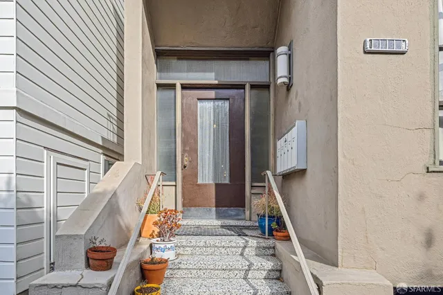 a view of entryway with wooden floor