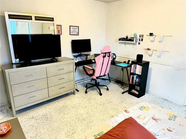 a view of a workspace with furniture