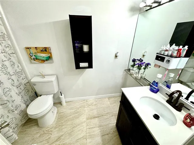 a bathroom with a sink and a toilet