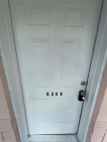 a view of a big room with carpet